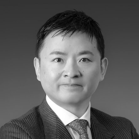 Atsushi Okada's headshot, greyscale